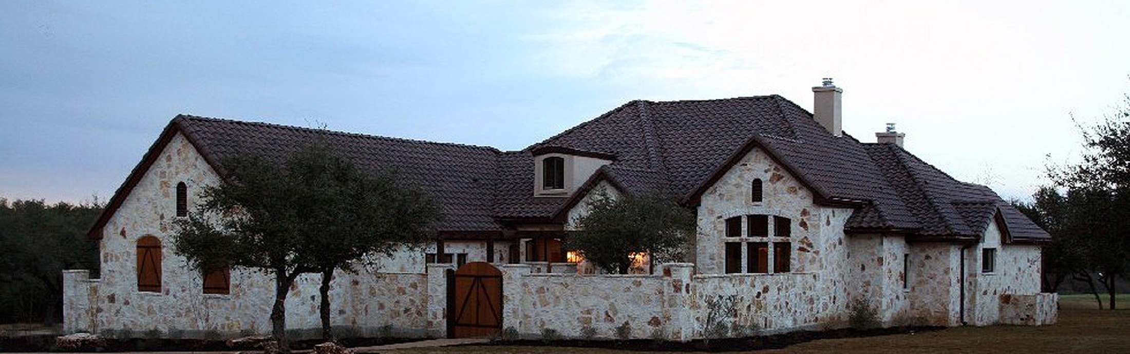 Custom home built by SDB+D in Spicewood, Texas, 2010, shown above a cutaway of its buried water well, OSSF field, propane tank and electric service